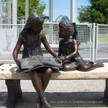 Estatua de lectura de niña de bronce